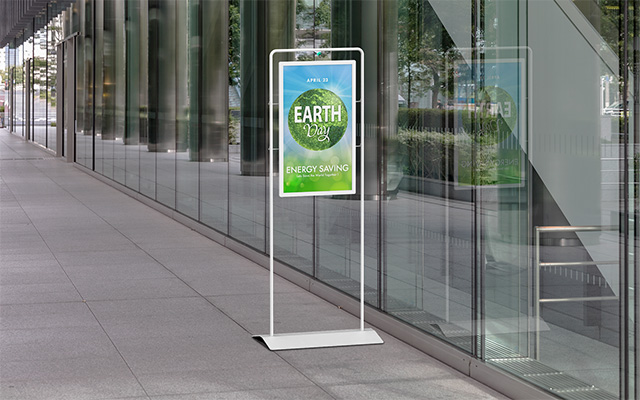 floor standing signage outside a glass fronted building