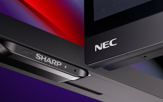 Close up of two large format displays each with a NEC or Sharp logo